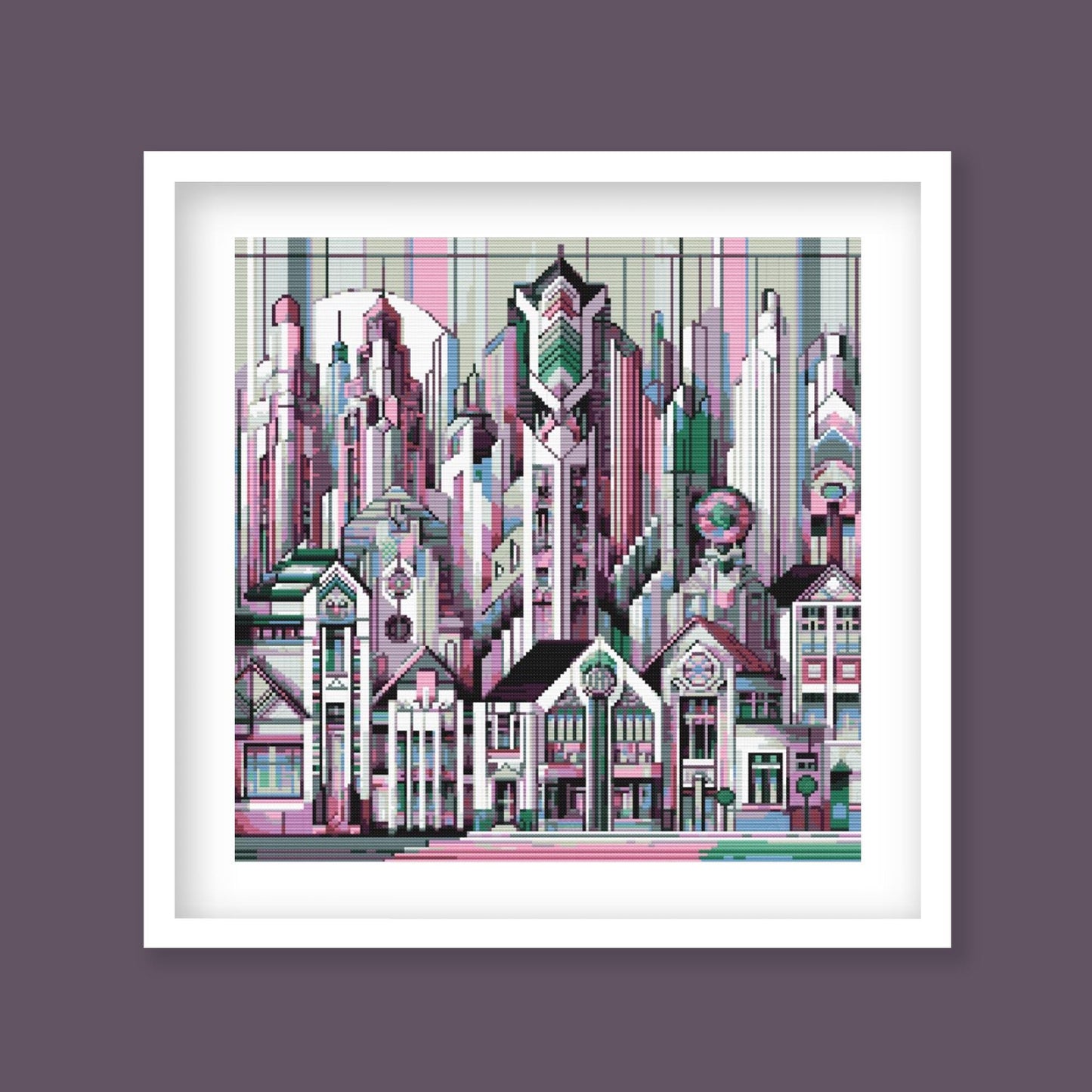 Art Deco City Cross Stitch Pattern displayed in a black frame with a decorative geometric skyline and modern architectural wall art style.