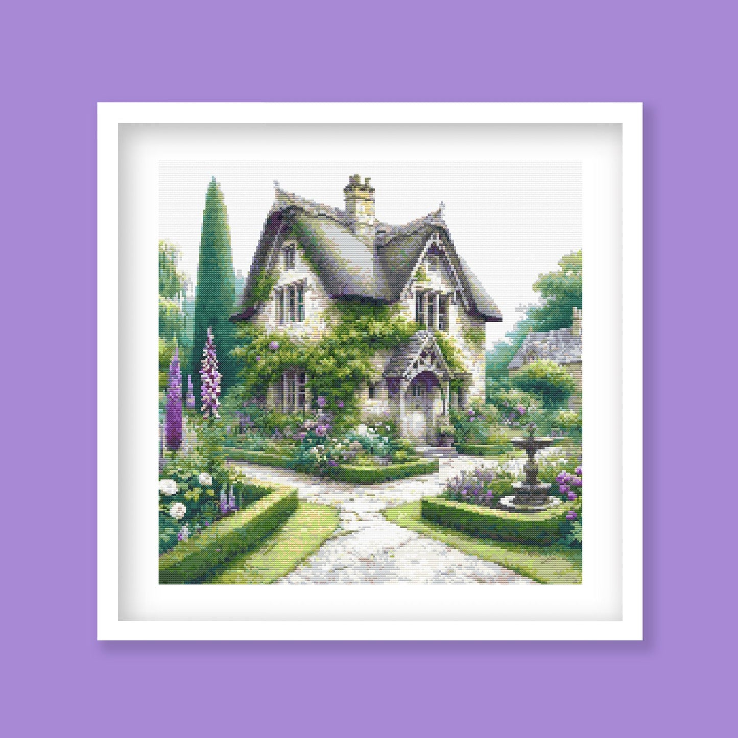 Charming English Cottage Cross Stitch Pattern displayed as framed wall art with a cottage garden, stone pathway, purple flowers, and soft countryside detail.