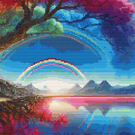 Close-up of Crimson Rainbow Tree Cross Stitch Pattern showing the red blossom tree, moonlit sky, blue clouds, and visible stitch texture.