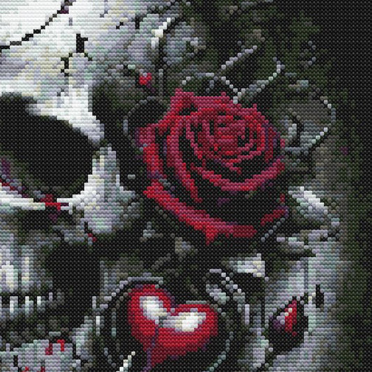 Close-up of Gothic Skull and Roses Cross Stitch Pattern showing a red rose, skull detail, dark background, and gothic floral artwork.