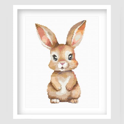 Bunny rabbit cross stitch pattern featuring a cute tan rabbit with large ears, bright eyes and soft shading, designed as a nursery or children’s room digital PDF chart.