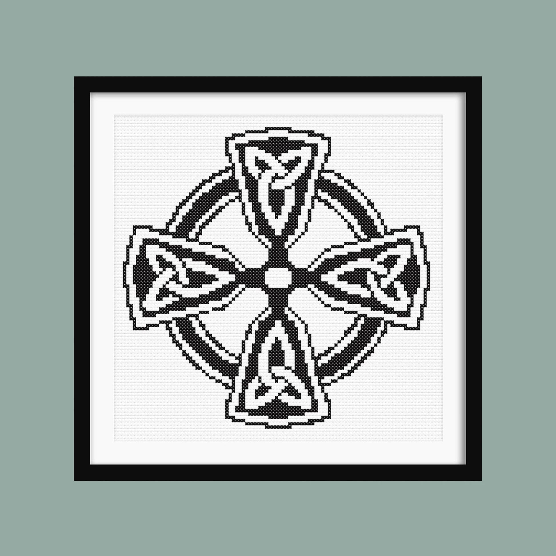 Celtic Infinity Cross Stitch Pattern displayed in a sage green frame, styled as symbolic black and white wall art.