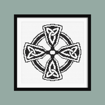 Celtic Infinity Cross Stitch Pattern displayed in a sage green frame, styled as symbolic black and white wall art.