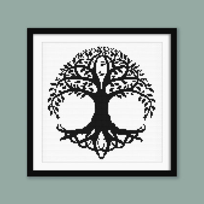 Celtic Tree of Life Cross Stitch Pattern displayed in a sage green frame, styled as symbolic black and white wall art.