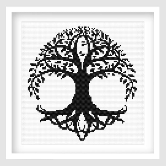 Celtic Tree of Life Cross Stitch Pattern displayed in a white frame, featuring a bold black and white tree design with Celtic knotwork details.