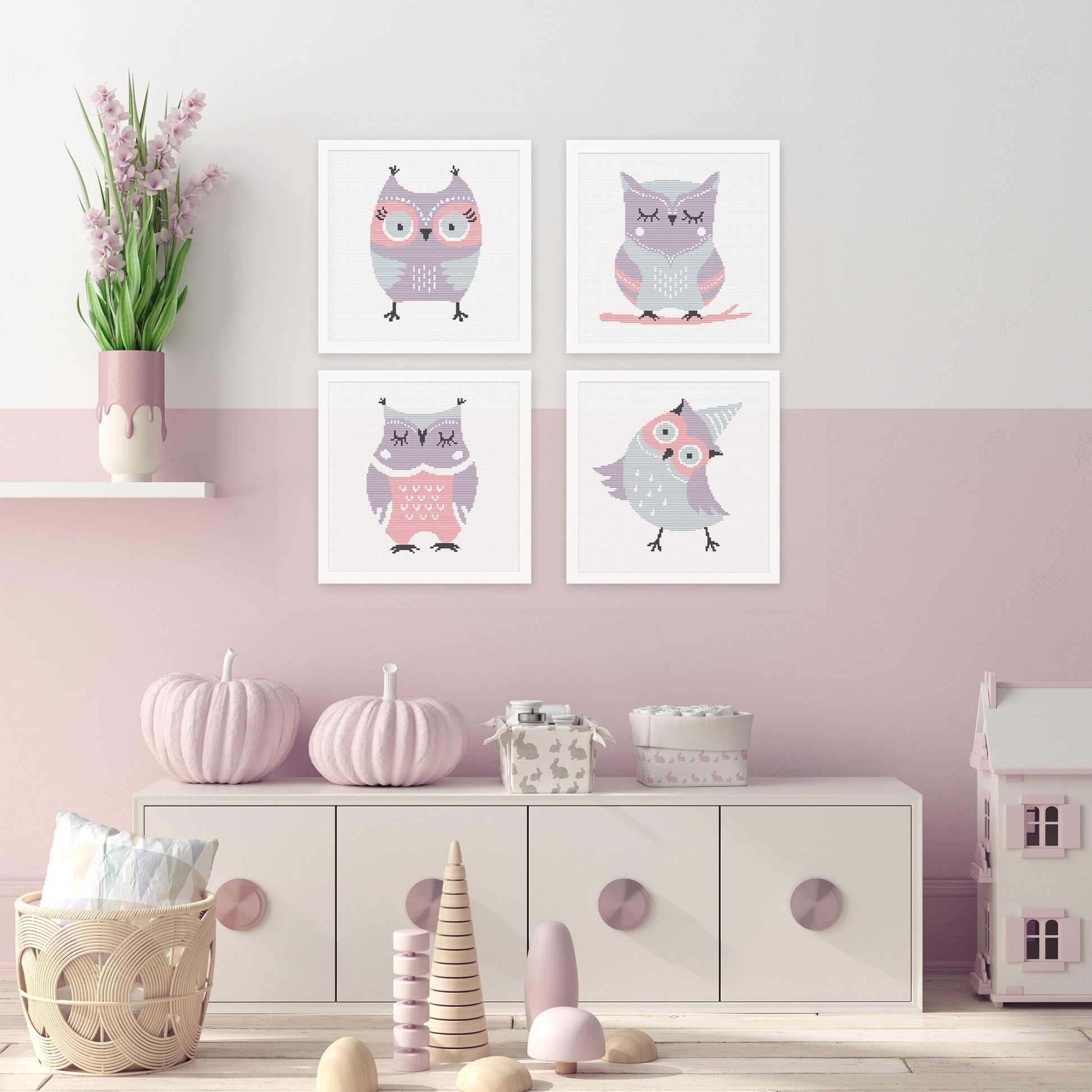 Collection of four cute owl cross stitch patterns displayed together as coordinated nursery wall art in soft pastel colours.