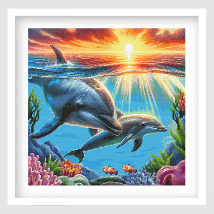 Dolphin cross stitch pattern shown as framed wall art with a bright ocean scene, playful dolphin design, and colourful sea-inspired style