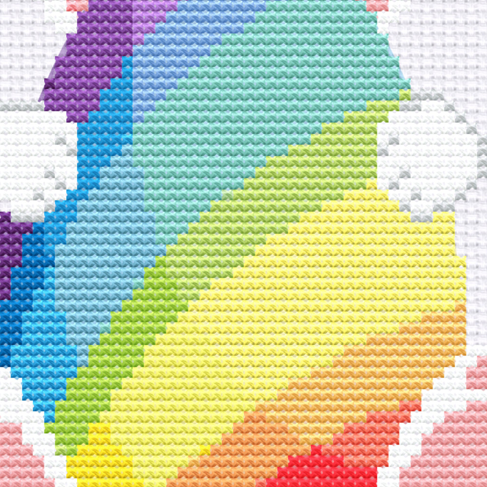 Close-up of rainbow bunny cross stitch stitches and colours.