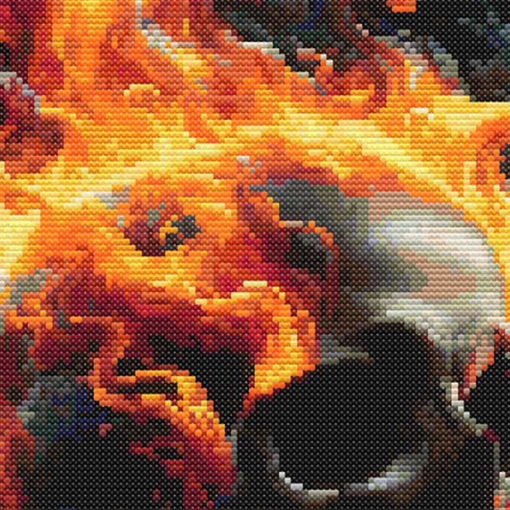Flaming Skull Cross Stitch Pattern flame detail highlighting intense orange, yellow and red fire tones from the gothic skull design.