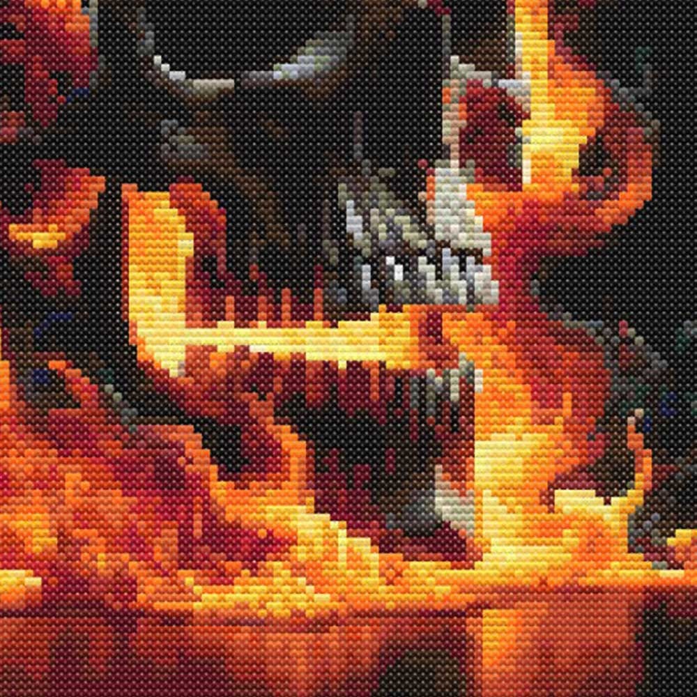 Flaming Skull Cross Stitch Pattern close-up showing the skull face, bright orange fire details and dramatic dark fantasy styling.