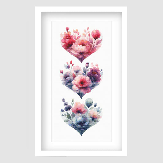 Floral hearts cross stitch pattern featuring three stacked heart-shaped flower arrangements in soft pink, purple and blue tones, designed as a romantic botanical digital PDF chart.