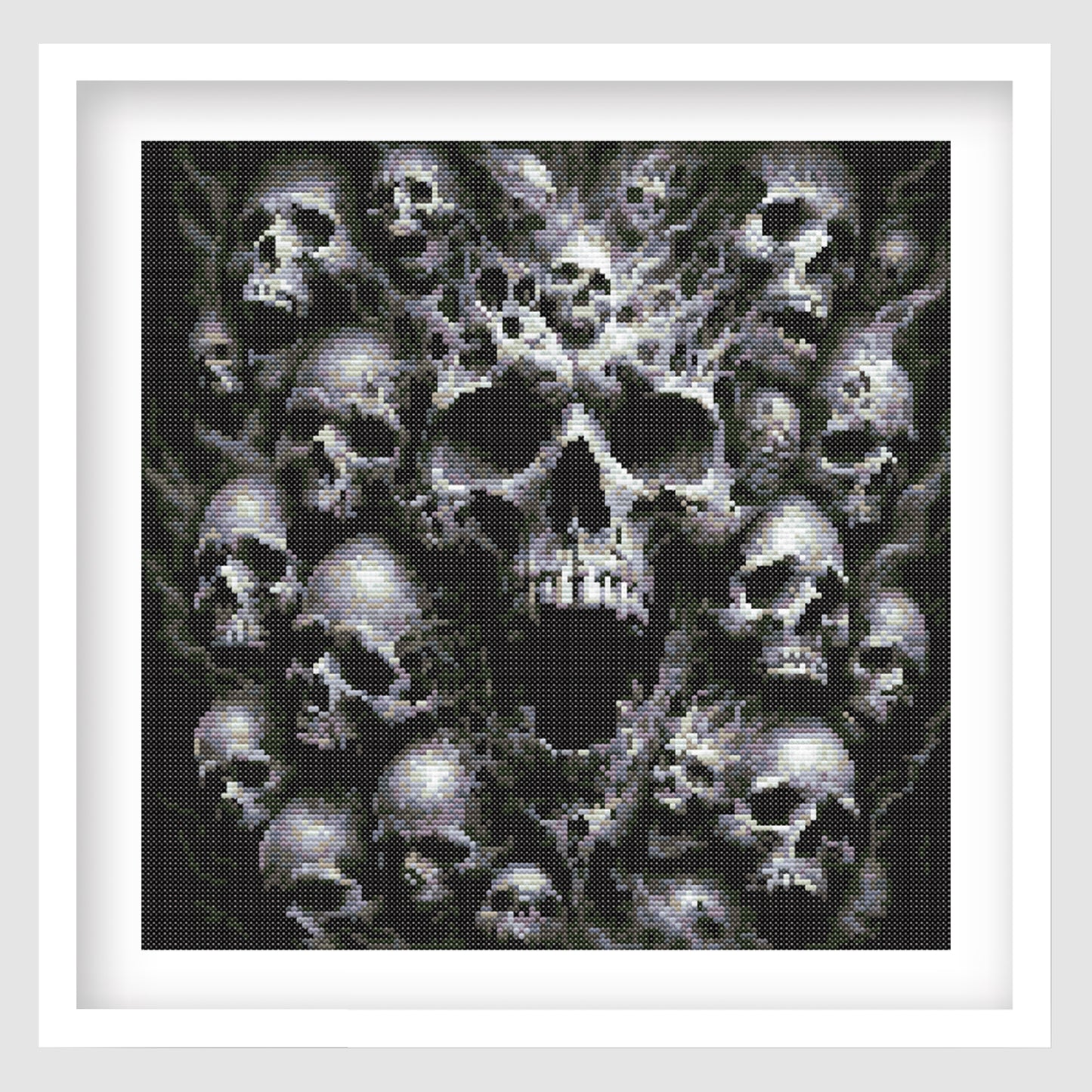 Framed artwork of a central skull surrounded by smaller skulls on a white background