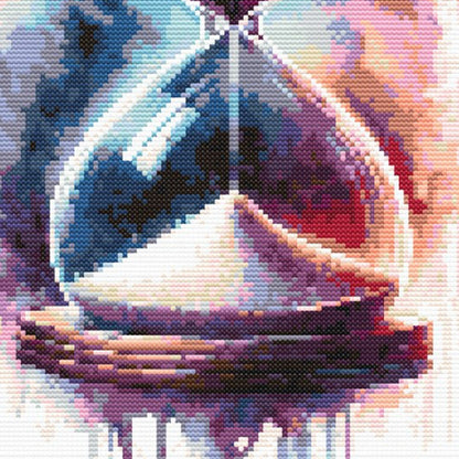 Close-up of Gothic Hourglass Skull Cross Stitch Pattern showing the hourglass shape, dramatic colour, and visible stitch texture.