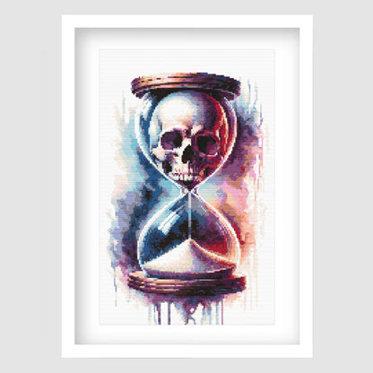 Skull in hourglass cross stitch pattern featuring a gothic skull and timepiece design.