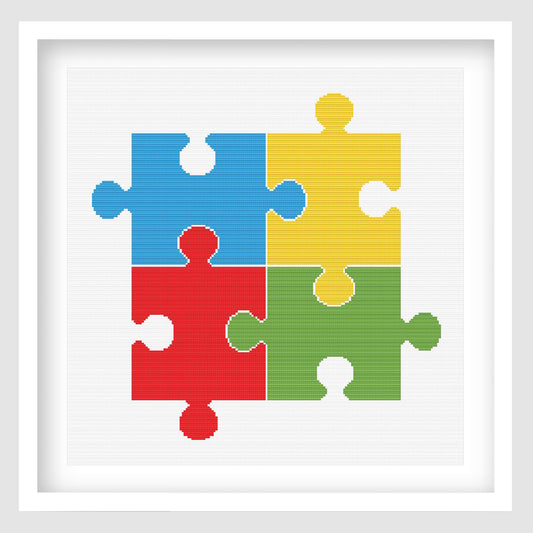Colourful puzzle pieces cross stitch pattern featuring four interlocking jigsaw pieces in blue, yellow, red and green on a clean white background.