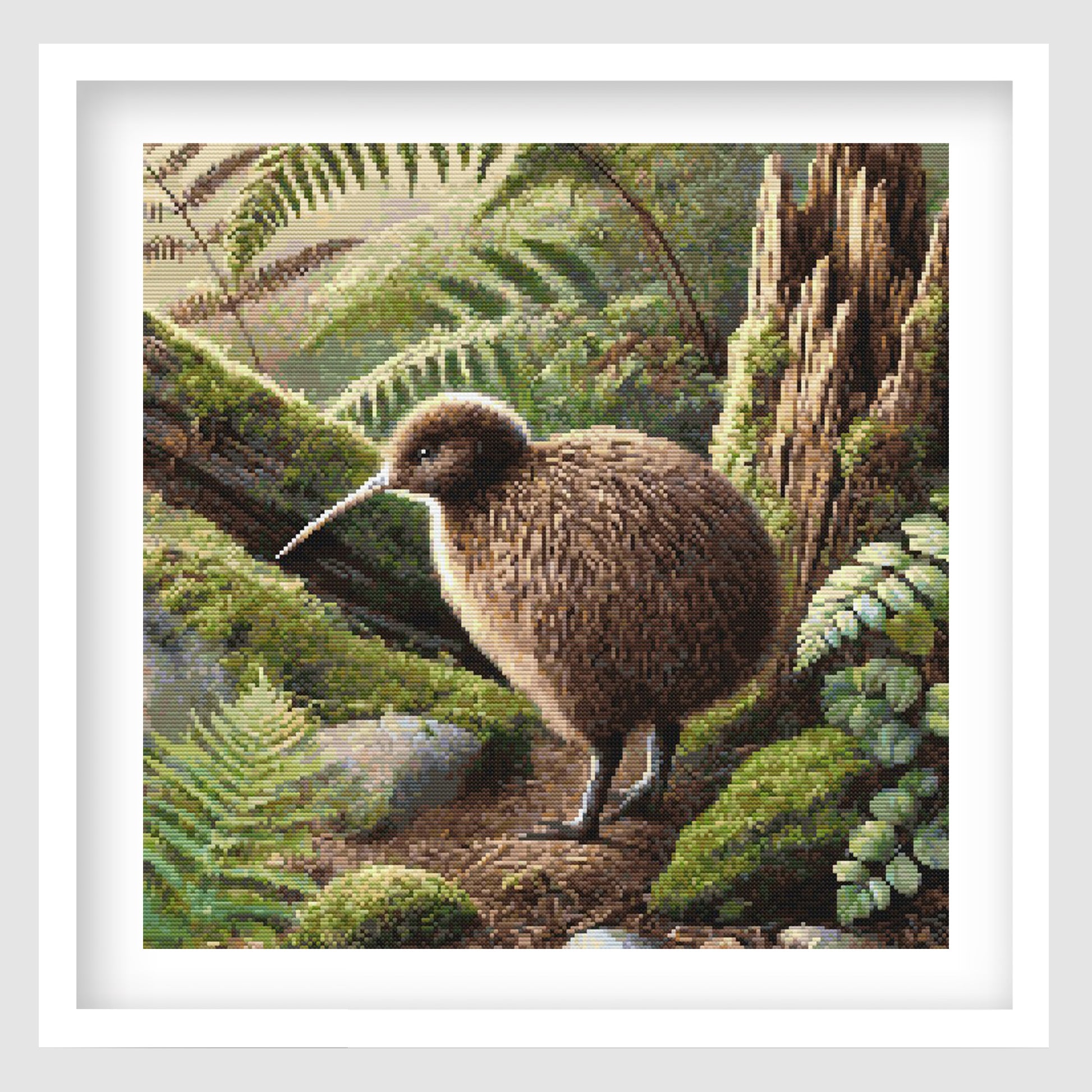 Kiwi cross stitch pattern featuring a brown kiwi bird in a lush New Zealand forest setting, surrounded by mossy logs, ferns and native greenery.