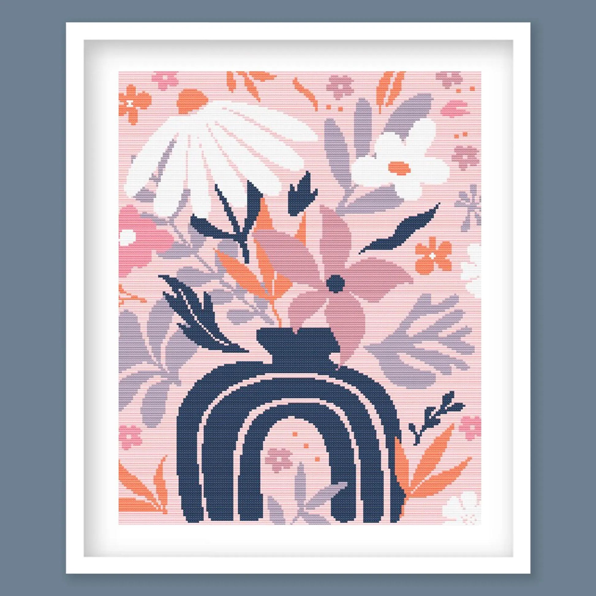 Modern Floral Cross Stitch Pattern featuring a modern arch motif with pink floral details, navy accents and botanical styling.