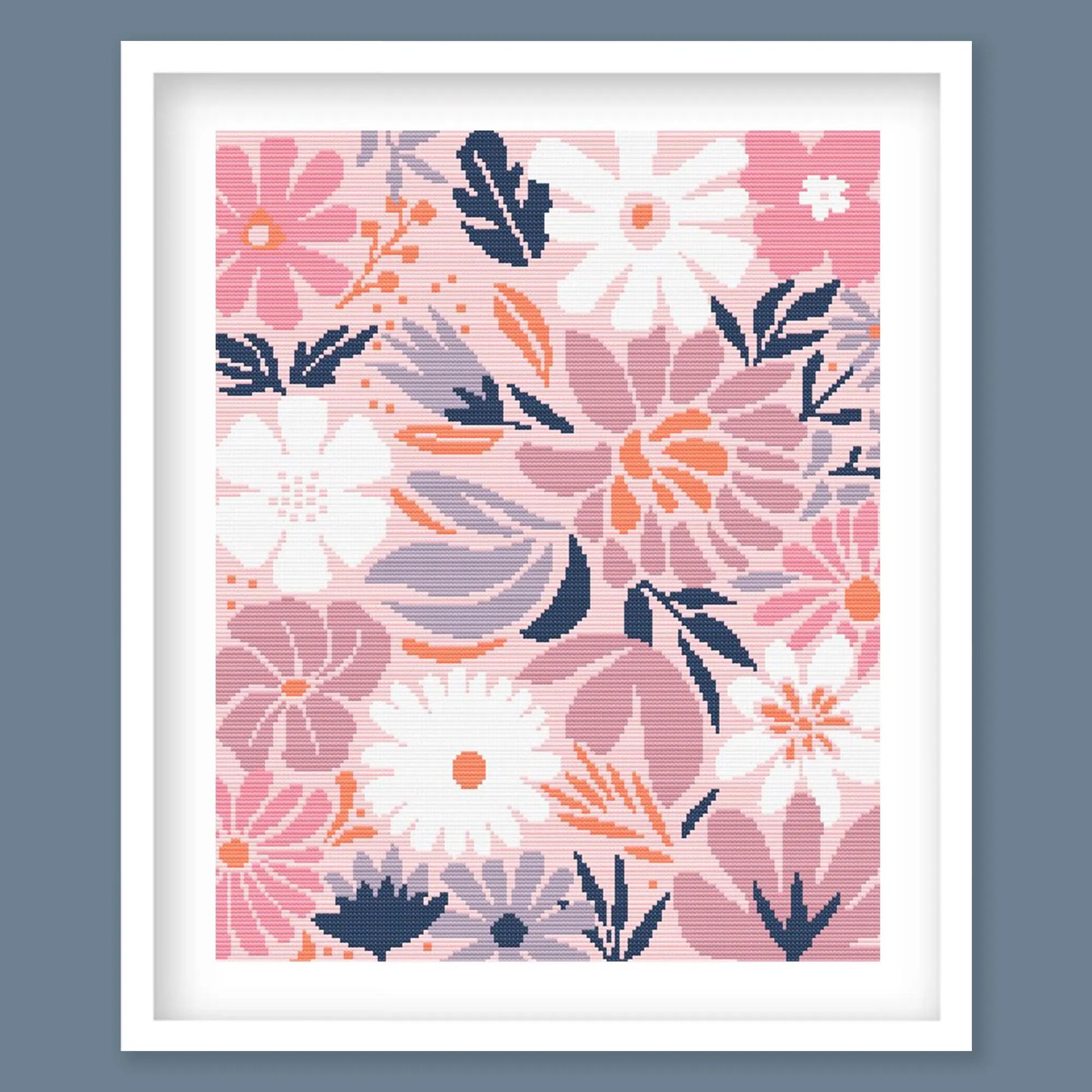 Modern Floral Cross Stitch Pattern featuring a detailed botanical bouquet with pink flowers, navy foliage and soft peach tones.