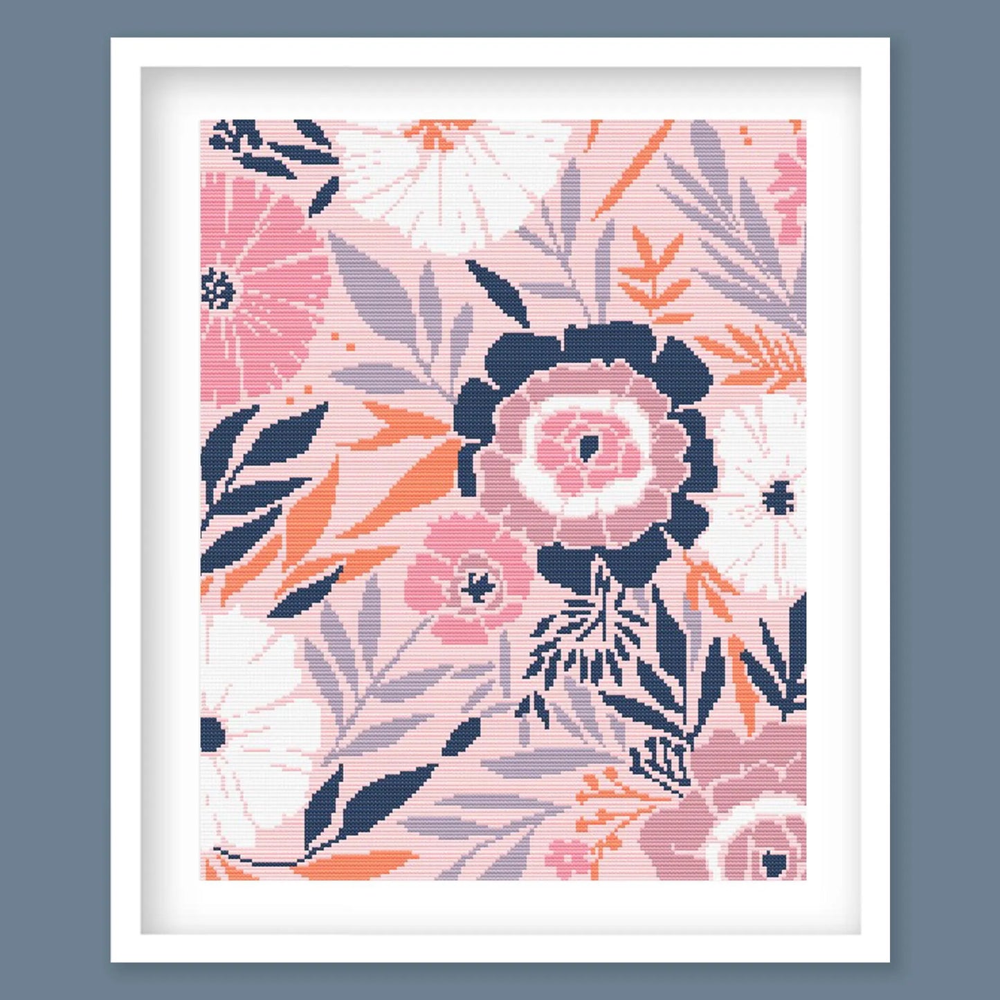 Modern Floral Cross Stitch Pattern featuring soft pink flowers, navy leaves and botanical details in a framed design.