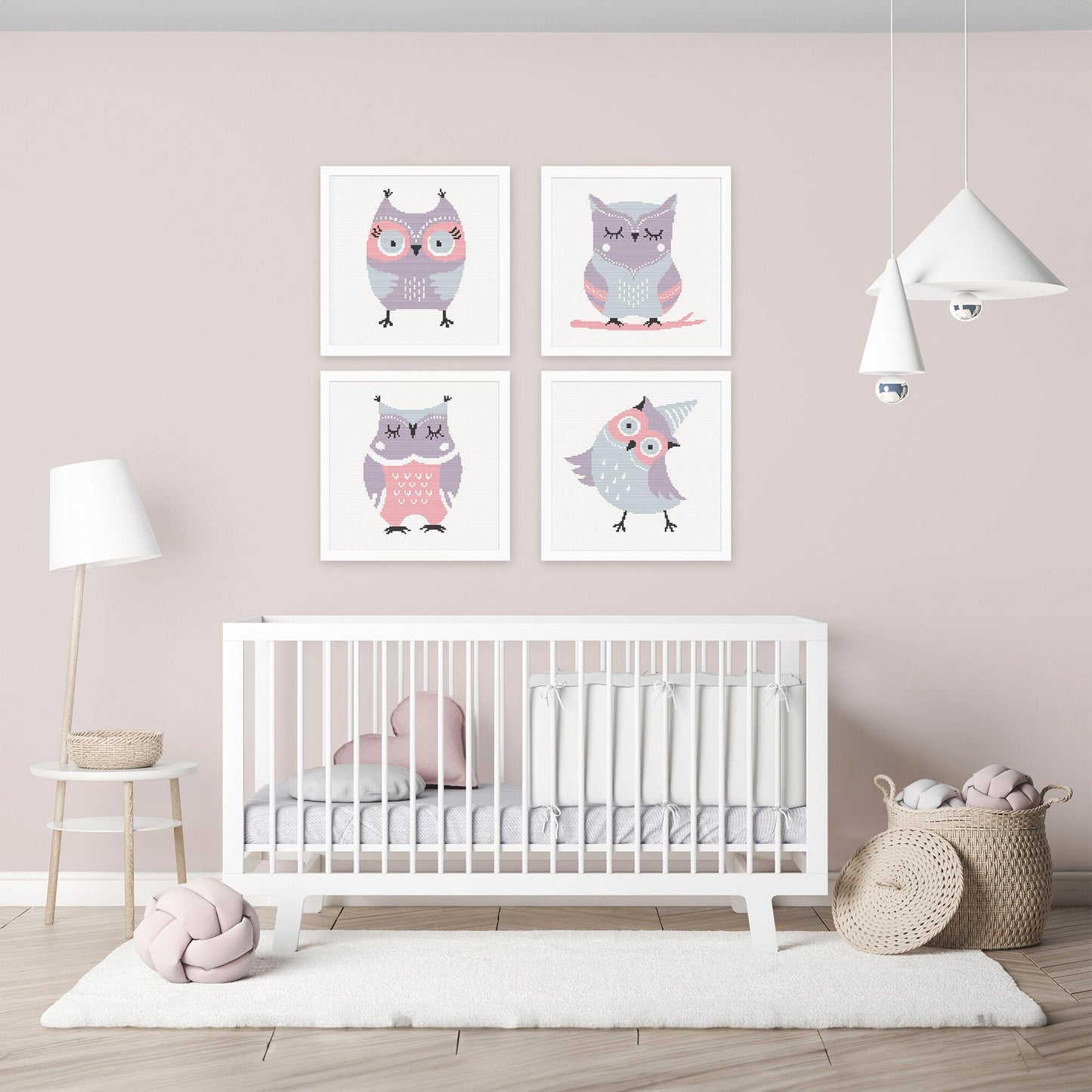 Cute owl cross stitch patterns displayed as framed artwork in a modern nursery, creating a soft and playful woodland theme.