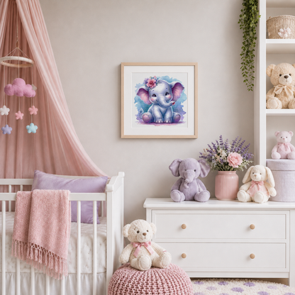 Elephant cross stitch pattern displayed as framed nursery wall art in a soft pink and lavender baby room with plush toys and crib decor.