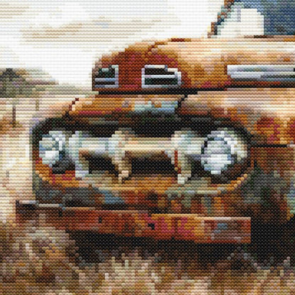 Looking at the front end of a rustic farms pick up truck, the grill and head lights add detail to the cross stitch pattern image.