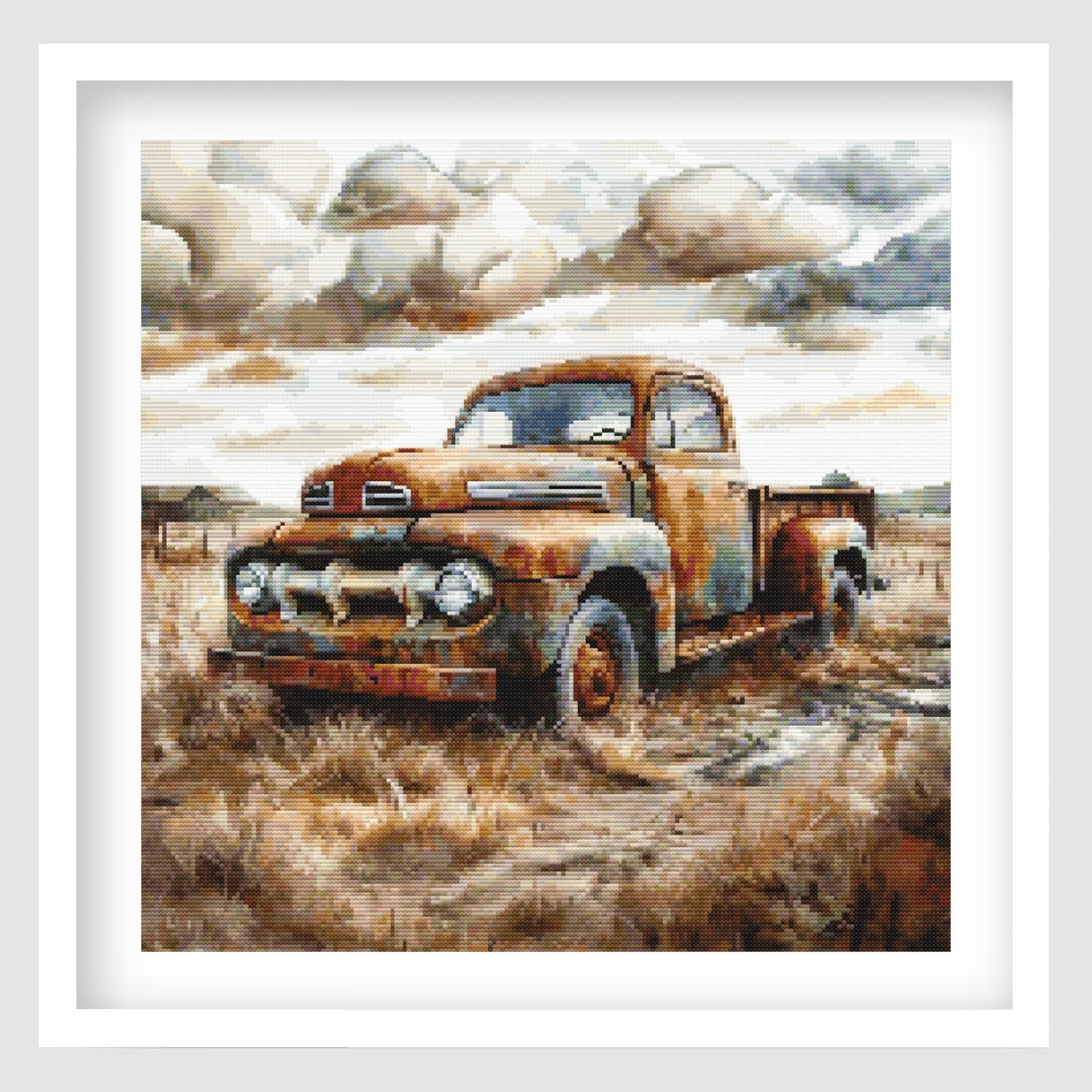 Rustic farm truck cross stitch pattern featuring an old weathered pickup truck in a dry rural field, with soft clouds, muted earthy tones and vintage countryside detail.