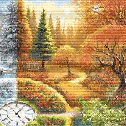 Close-up of A Stitch in Time Cross Stitch Pattern showing warm autumn trees, golden light, garden paths, and rich seasonal colour.