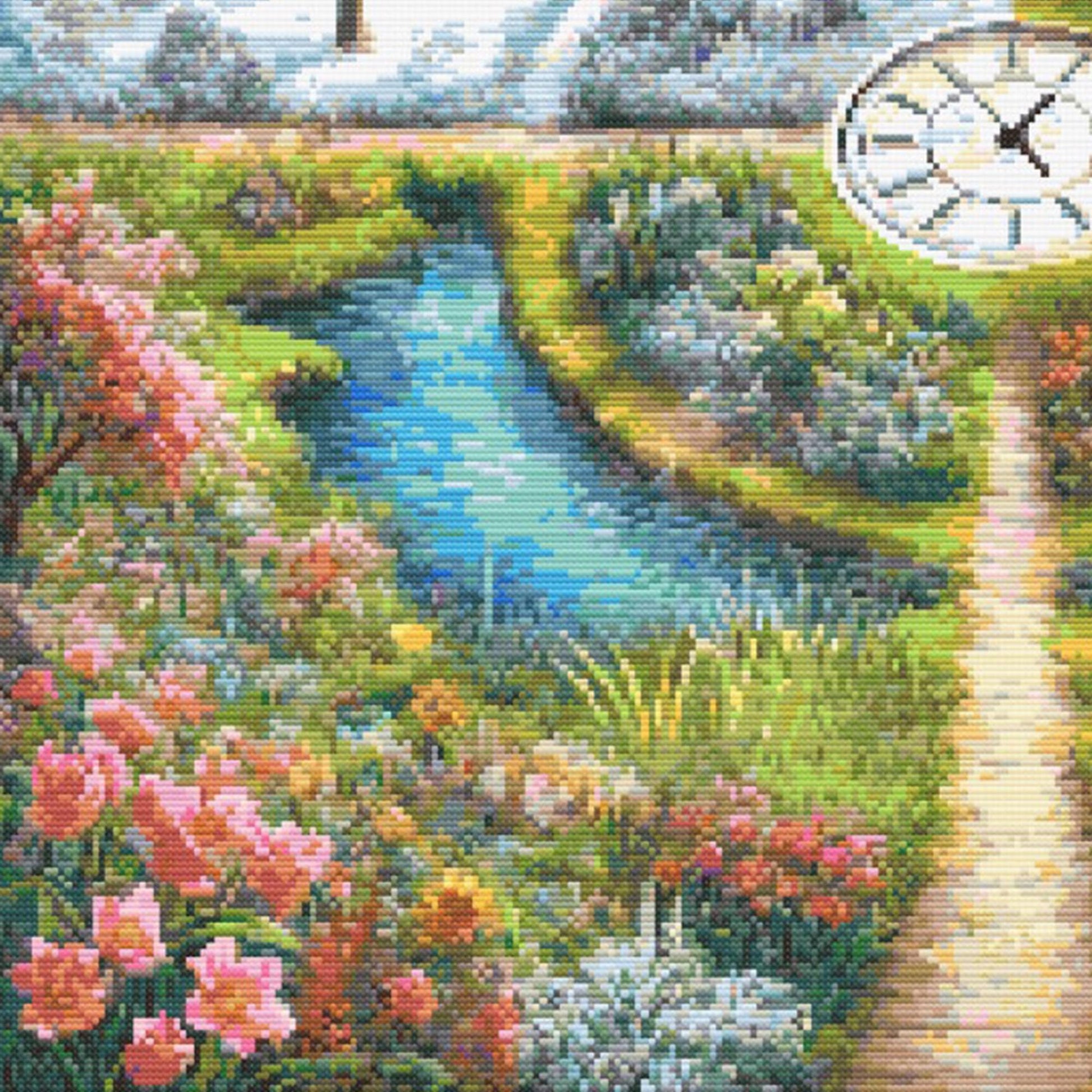 Close-up of A Stitch in Time Cross Stitch Pattern showing spring flowers, green garden paths, water detail, and bright seasonal stitching colour.