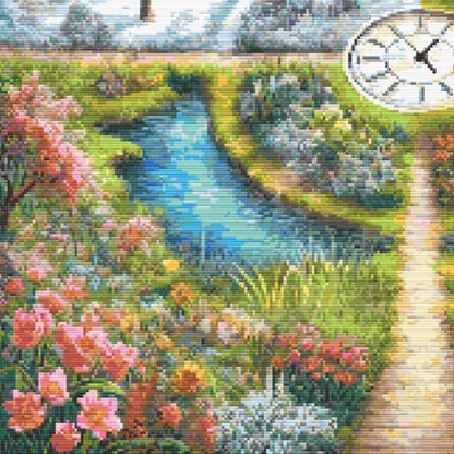 Close-up of A Stitch in Time Cross Stitch Pattern showing spring flowers, green garden paths, water detail, and bright seasonal stitching colour.