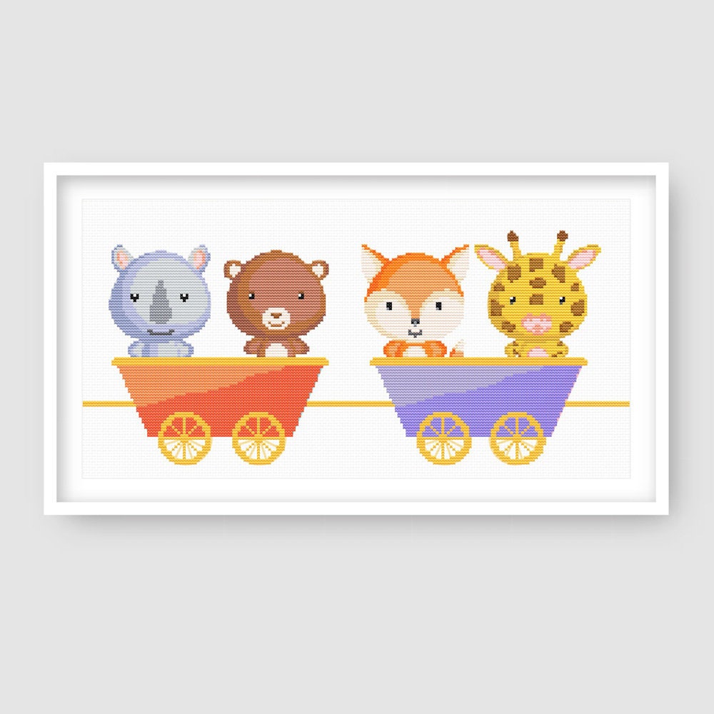 Close-up of Animal Train Cross Stitch Pattern Set showing elephant and tiger characters riding in pastel train carriages.