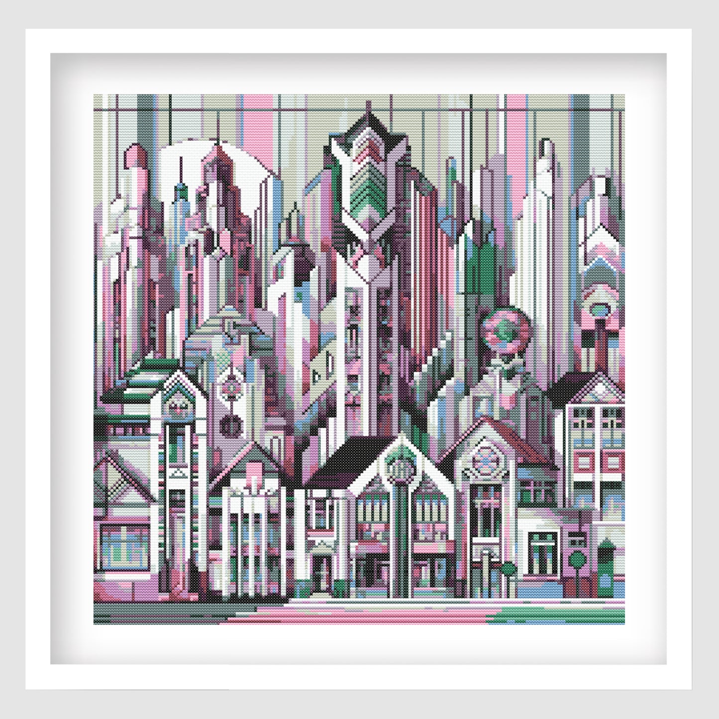 Art Deco City Cross Stitch Pattern displayed as framed wall art with a geometric skyline, decorative architecture, and soft pink, teal, black, and cream tones.