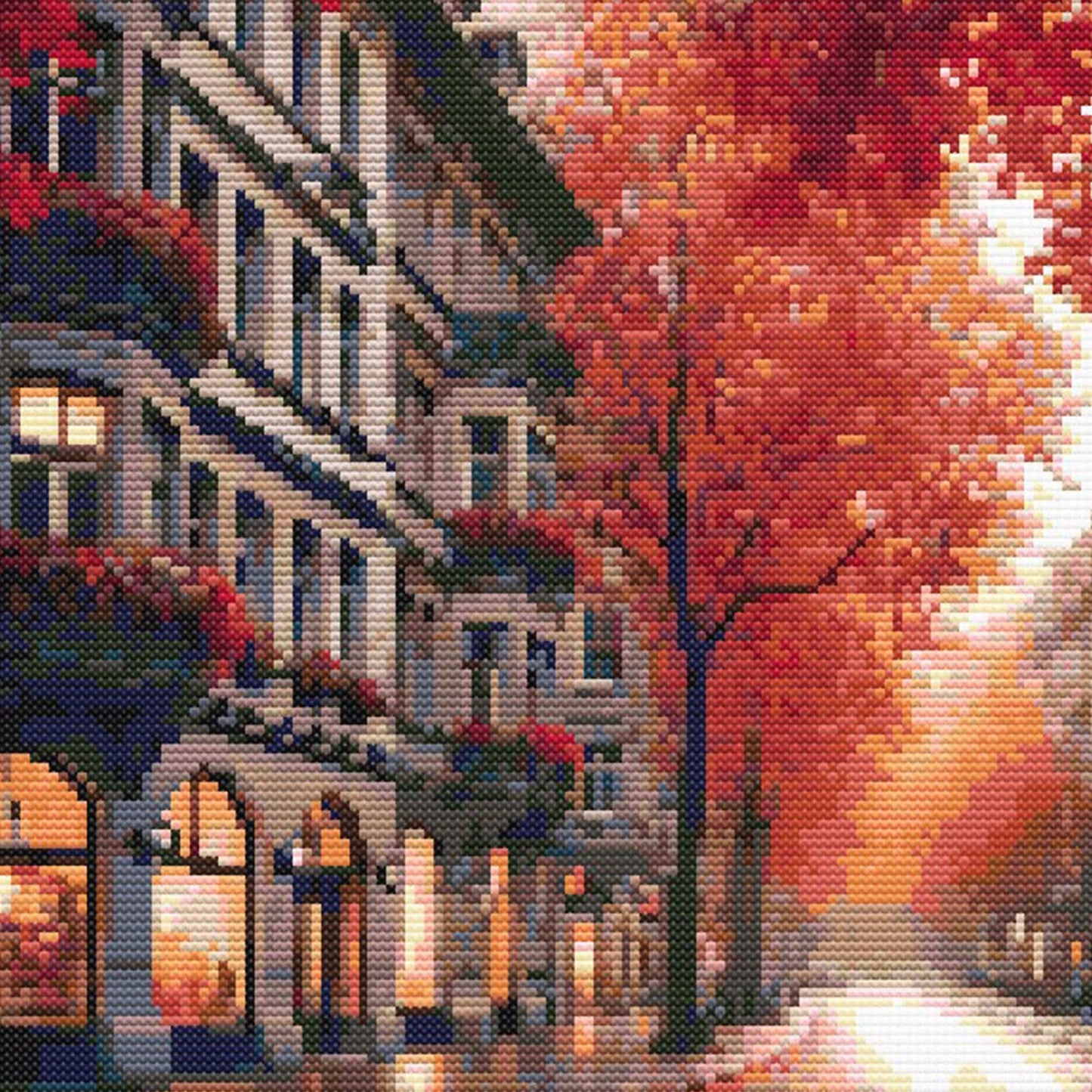 Autumn Cityscape Cross Stitch Pattern featuring a city street lined with red autumn trees, warm light, and detailed urban architecture.
