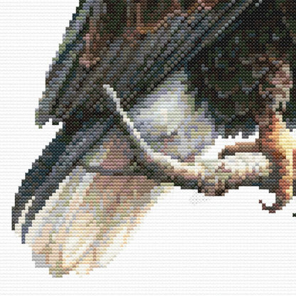 Close up image of a branch and the lower part of a bald eagle on a branch.