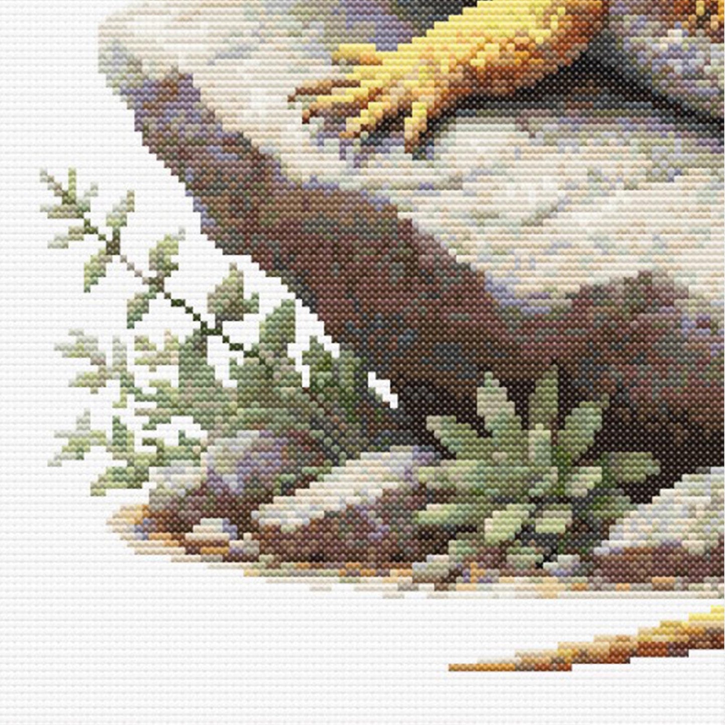 Close up of a Cross stitched lizard on a rock with plants