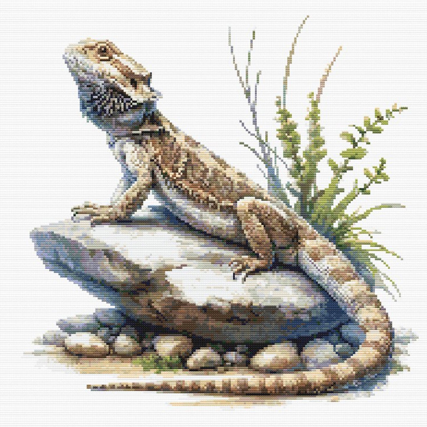 Bearded Dragon Lizard Cross Stitch Pattern featuring a detailed bearded dragon resting on rocks with grass detail and natural reptile styling.