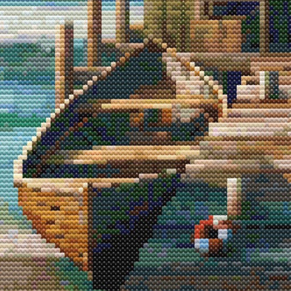 Close-up of Boat Shed Cross Stitch Pattern showing a wooden rowboat, jetty boards, buoy, and seaside detail.