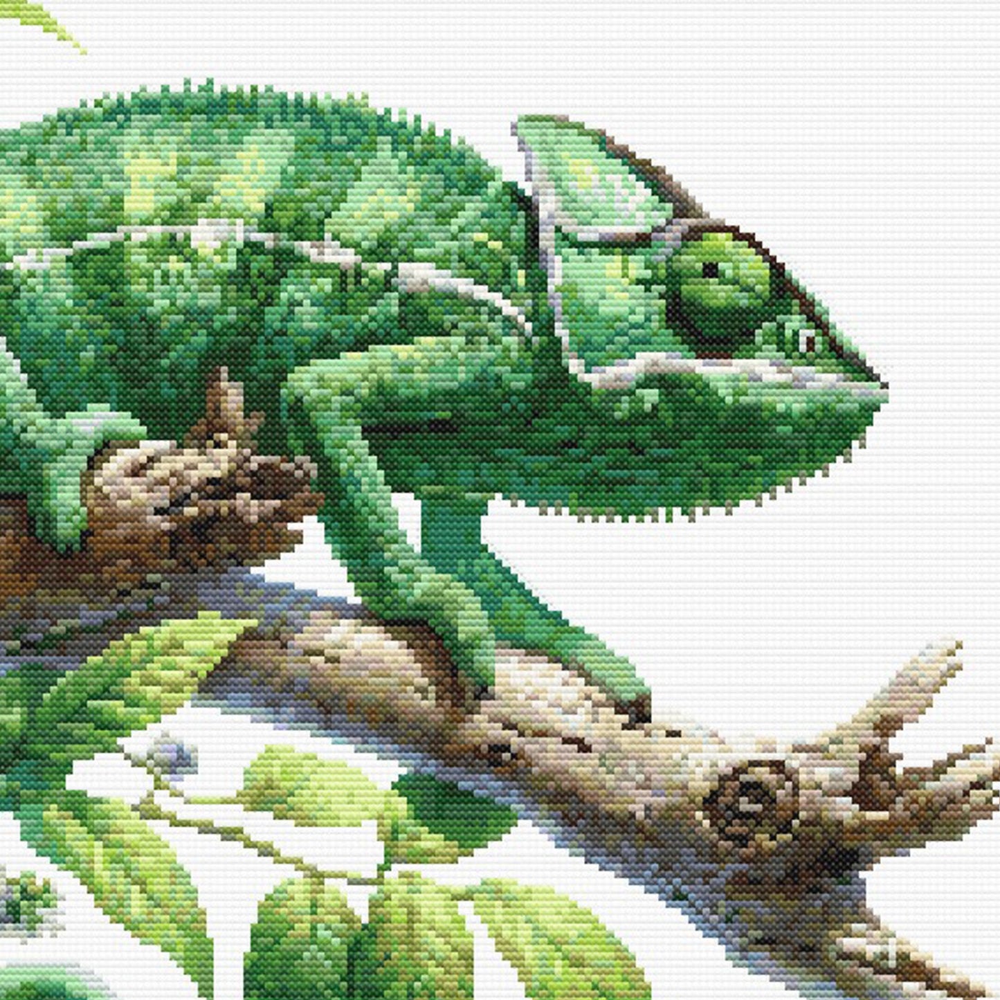 Cross-stitched pattern of a green chameleon on a branch