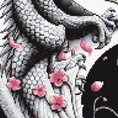 Close-up of Chinese Dragon Cross Stitch Pattern showing detailed dragon scales, cherry blossom accents, and dark fantasy stitching style.