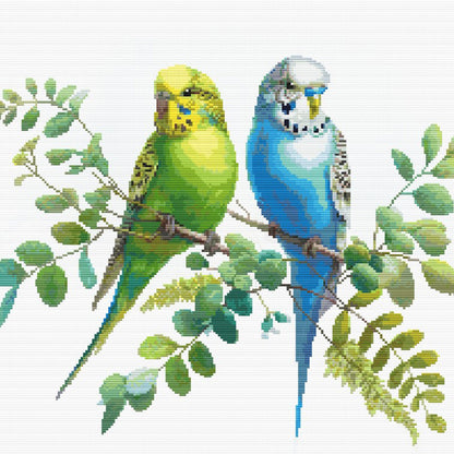 Colorful Budgies Cross Stitch Pattern featuring two pet budgies perched together with leafy branches and cheerful bird detail.