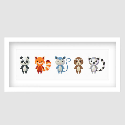 Cute Woodland Animal Cross Stitch Pattern displayed as framed wall art with a row of colourful forest animals for nursery or kids room decor.