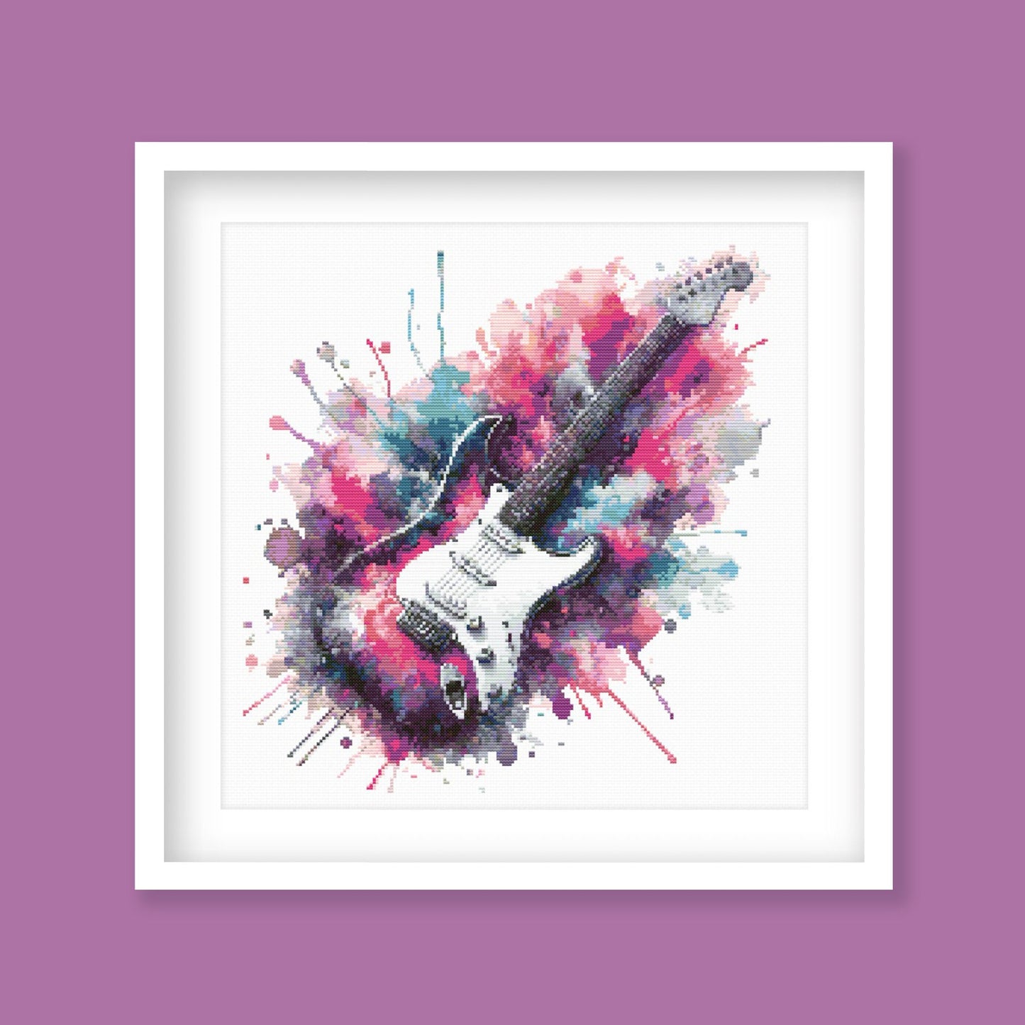 Electric Guitar Cross Stitch Pattern displayed as framed wall art with a colourful electric guitar, paint splash detail, and music-inspired design.