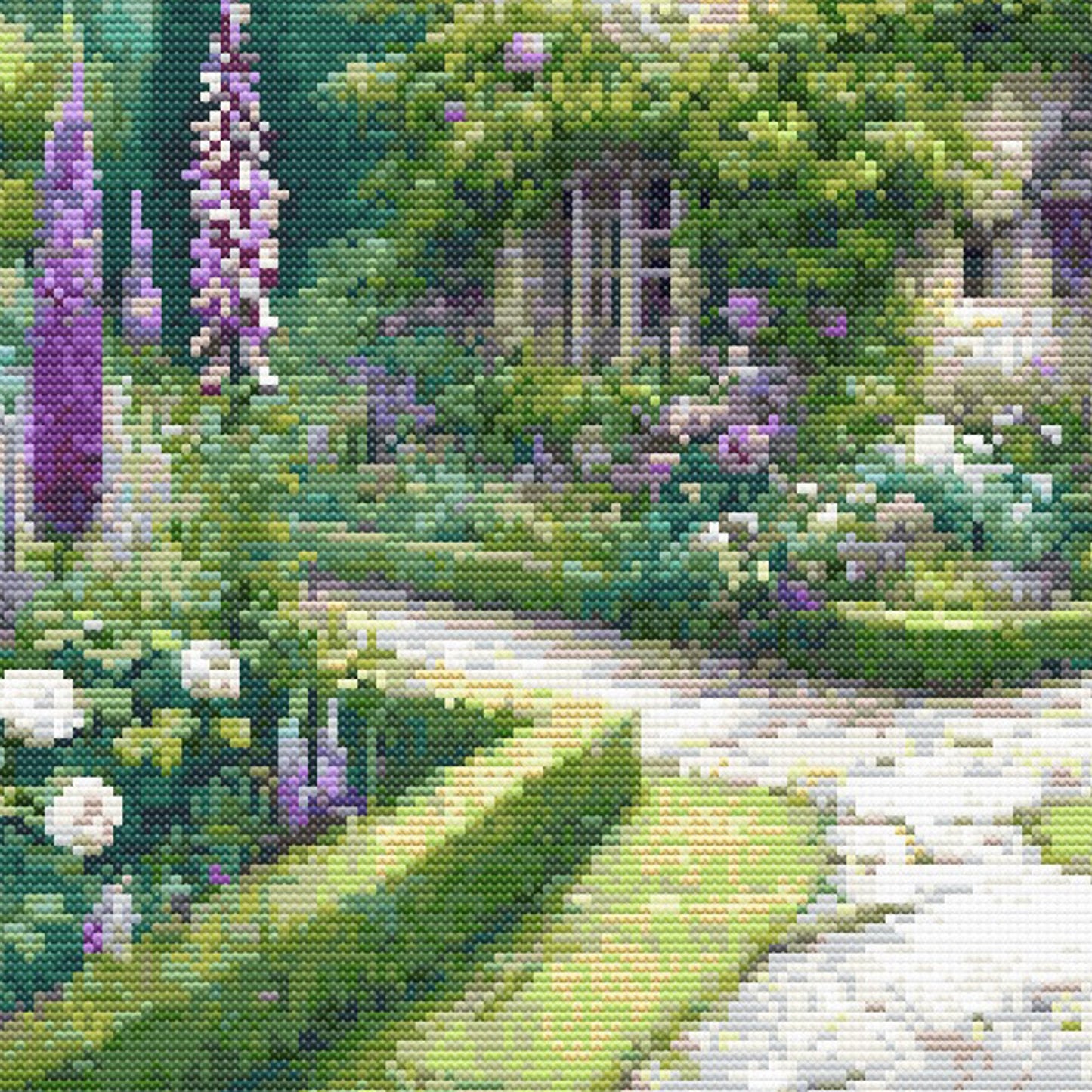 Close-up of Charming English Cottage Cross Stitch Pattern showing garden paths, purple flowers, green hedges, and visible counted cross stitch texture.