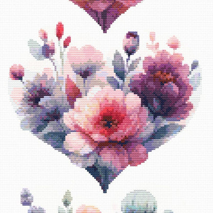 Close-up of Floral Heart Cross Stitch Pattern Set showing a blue and pink floral heart with soft leaves, flower detail, and counted cross stitch texture.