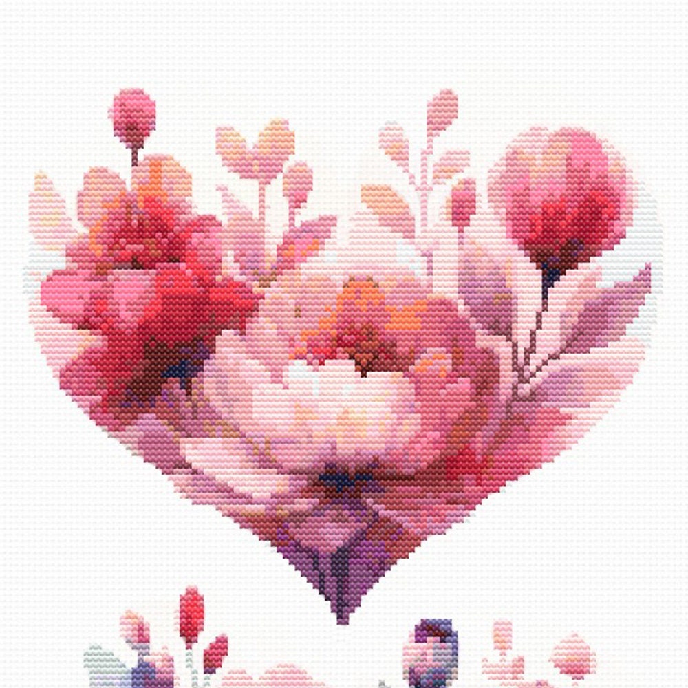 Close-up of Floral Heart Cross Stitch Pattern Set showing a pink floral heart with soft petals, botanical detail, and visible counted cross stitch texture.