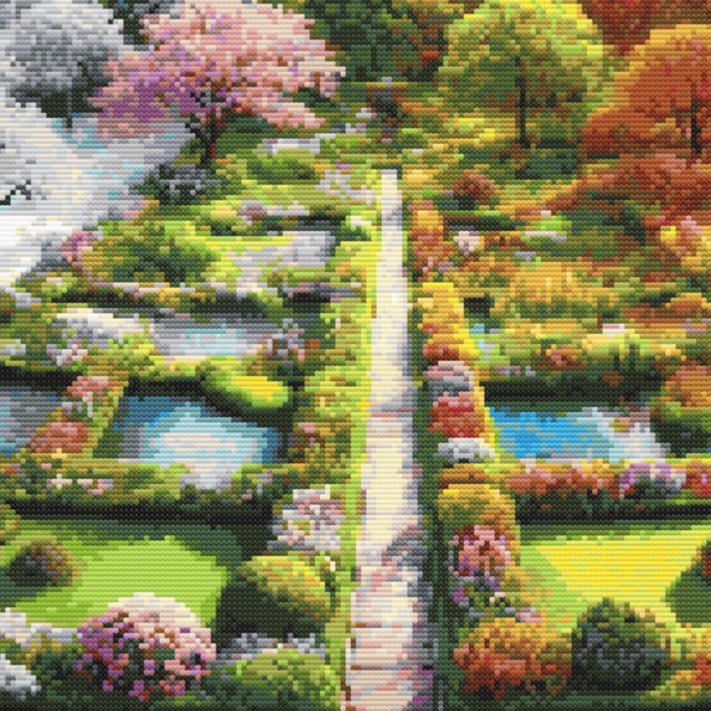 Close-up of Four Seasons Garden Cross Stitch Pattern showing spring garden paths, pink blossoms, green hedges, and colourful seasonal detail.