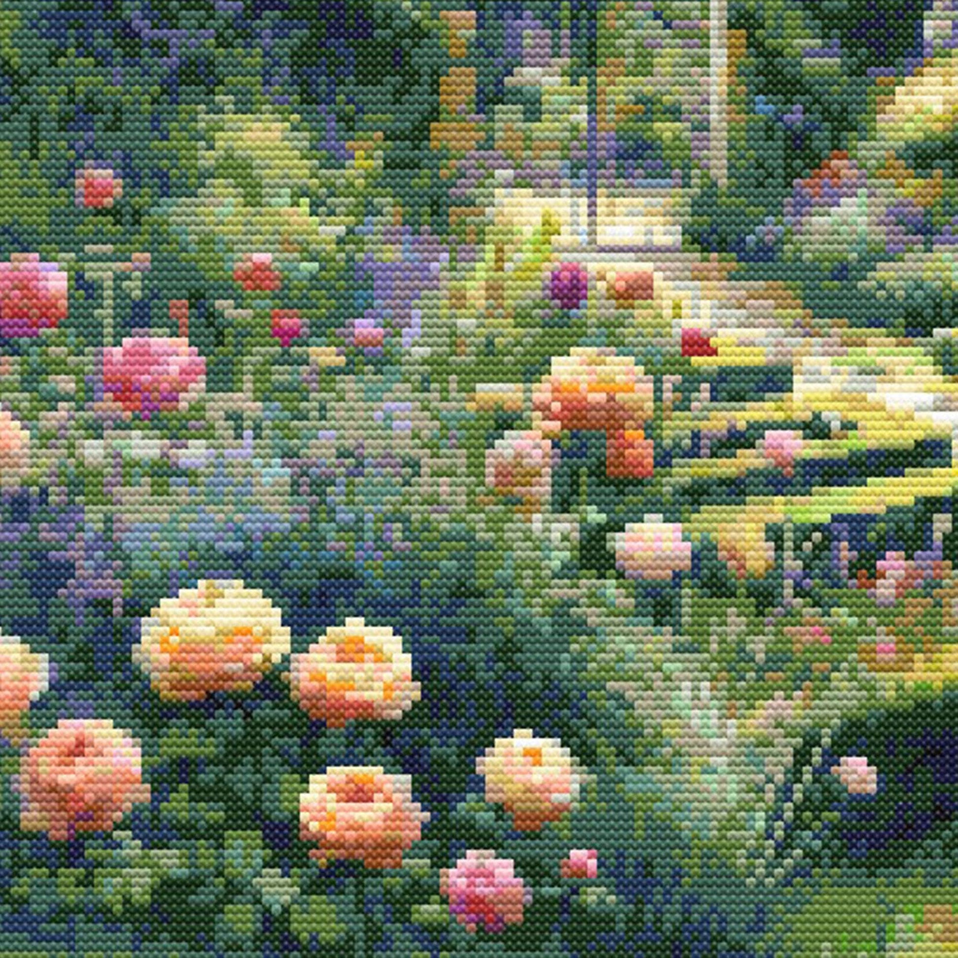 Garden Landscape Cross Stitch Pattern close-up featuring soft pink and peach flowers, lush green foliage, garden pathway detail, and visible counted cross stitch texture.