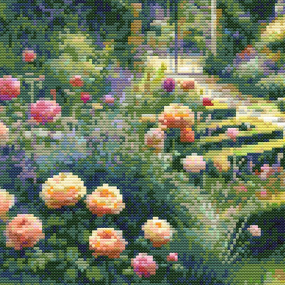 Garden Landscape Cross Stitch Pattern close-up featuring soft pink and peach flowers, lush green foliage, garden pathway detail, and visible counted cross stitch texture.