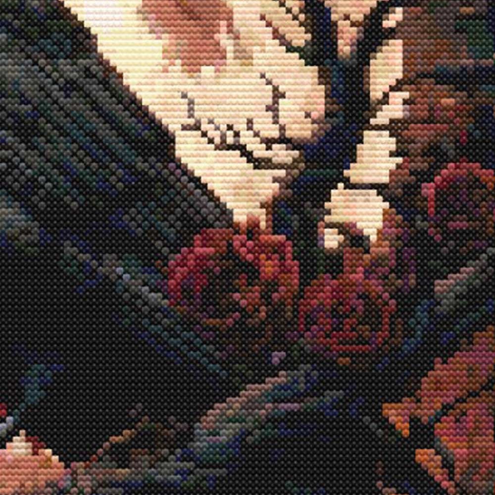 Close-up of gothic rose and branch details in a raven cross stitch pattern with deep red flowers, dark tones and a glowing blood moon.