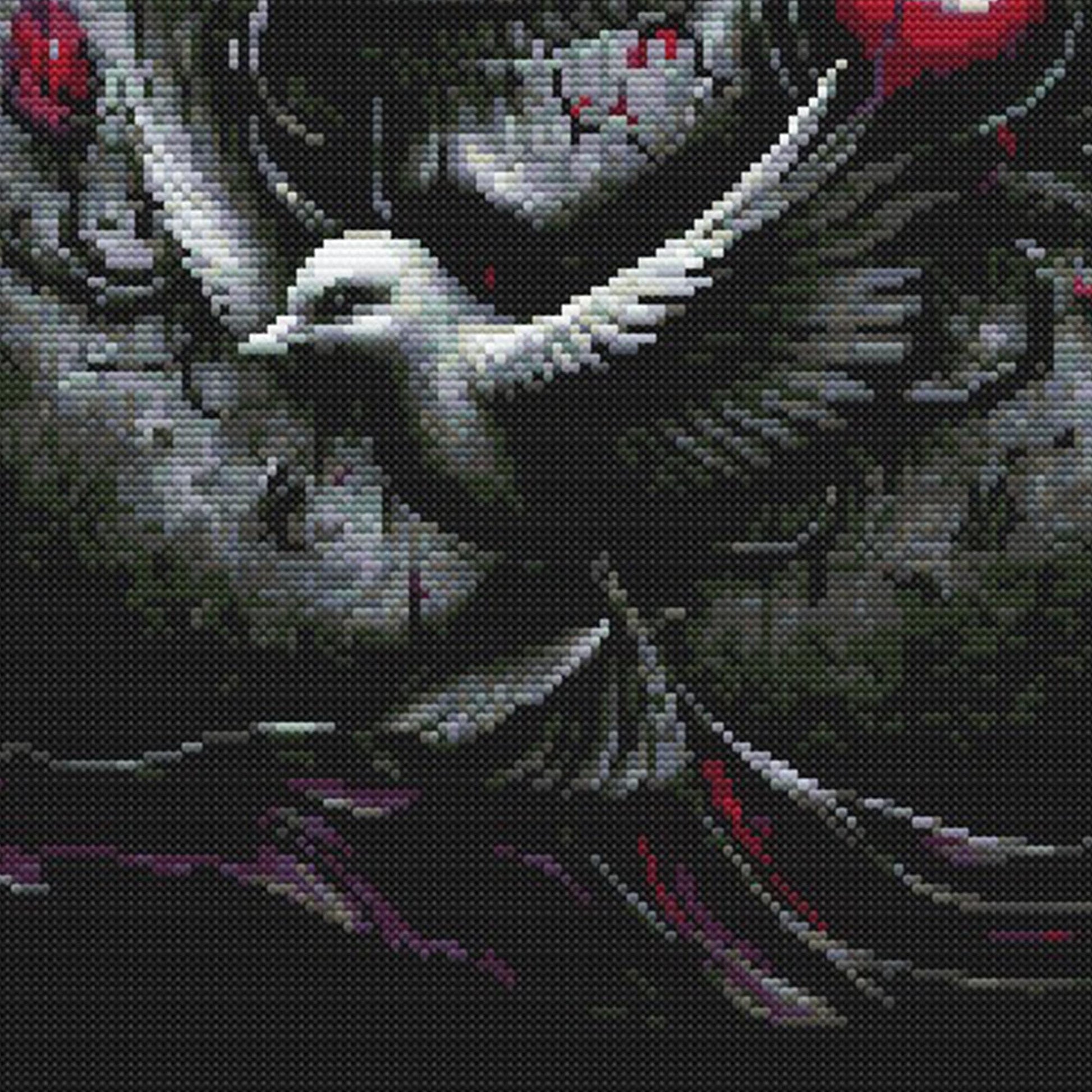 Close-up of Gothic Skull and Roses Cross Stitch Pattern showing skull shading, dark floral detail, red accents, and visible counted cross stitch texture.